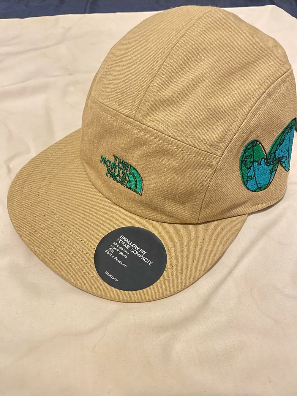 The North Face Tan Five-Panel Cap with Green Embroidered Logo and Patch